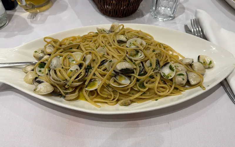 Spaghetti with clams on a fish-shaped plate